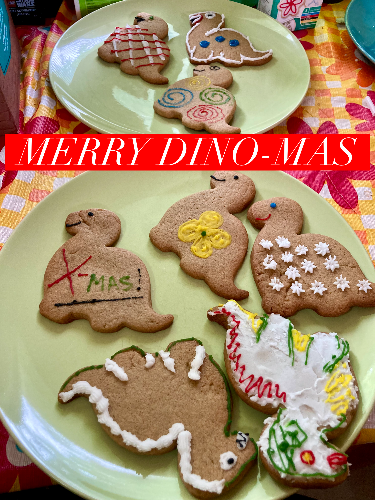Dinosaur gingerbread cookies overlaid with text reading Merry Dino-Mas